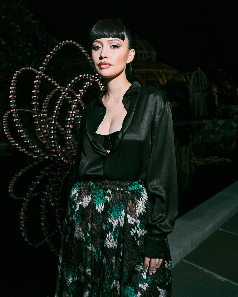 Portrait of Christian Serratos shot by fashion and celebrity photographer Emily Soto for Dior in the Brooklyn Botanic Garden in NYC