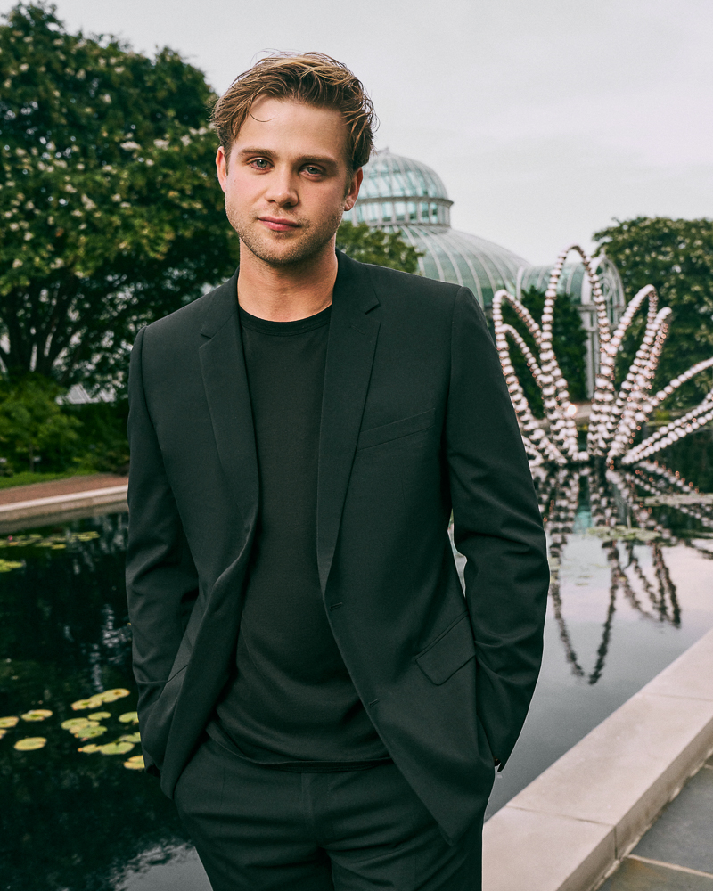Portrait of Leo Woodall shot by fashion and celebrity photographer Emily Soto for Dior in the Brooklyn Botanic Garden in NYC