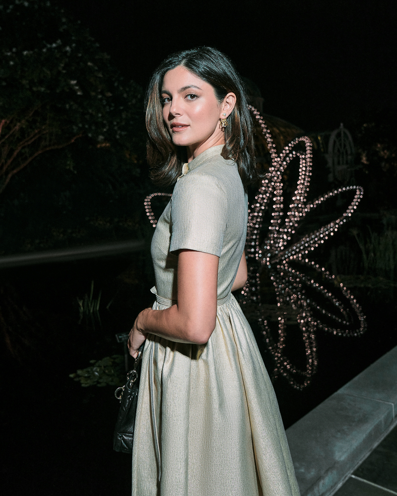 Portrait of Monica Barbaro shot by fashion and celebrity photographer Emily Soto for Dior in the Brooklyn Botanic Garden in NYC